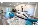 Spacious living room with comfortable seating and wood-look floors at 204 Apple Branch Dr, Woodstock, GA 30188