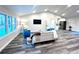 Bright living room with vaulted ceiling, hardwood floors, and modern furniture at 204 Apple Branch Dr, Woodstock, GA 30188