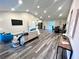 Open concept living and dining area with vaulted ceiling and wood-look floors at 204 Apple Branch Dr, Woodstock, GA 30188
