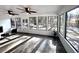 Sunroom with fireplace and ample natural light at 204 Apple Branch Dr, Woodstock, GA 30188