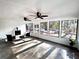 Sunroom with fireplace and ceiling fans at 204 Apple Branch Dr, Woodstock, GA 30188