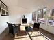 Cozy sunroom with fireplace and wooded views at 204 Apple Branch Dr, Woodstock, GA 30188