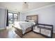 Cozy bedroom with large bed, neutral color scheme, and bright natural lighting at 220 Windsor Gate Ne Cv, Atlanta, GA 30342