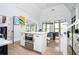Bright kitchen featuring a center island with stainless steel microwave and quartz countertop at 220 Windsor Gate Ne Cv, Atlanta, GA 30342