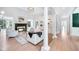 Spacious living room featuring hardwood floors, a fireplace, built-ins, and natural light at 220 Windsor Gate Ne Cv, Atlanta, GA 30342