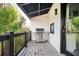 Outdoor patio area with built in grill and wooden deck at 220 Windsor Gate Ne Cv, Atlanta, GA 30342