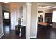 Open-concept design with a view to the kitchen with stainless steel appliances and dark hardwood flooring at 106 Puckett Ct, Canton, GA 30115