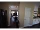 Dining room view leading to a kitchen with stainless steel appliances and white cabinetry at 106 Puckett Ct, Canton, GA 30115