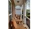 Charming front porch with inviting wooden seating and decorative railing at 106 Puckett Ct, Canton, GA 30115