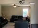 Bright living area with plush seating, a ceiling fan, and natural light from the windows at 106 Puckett Ct, Canton, GA 30115
