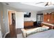 Spacious main bedroom with tray ceiling, ceiling fan, wood floors and plenty of natural light at 106 Puckett Ct, Canton, GA 30115