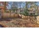 A spacious, fenced backyard with mature trees at 1057 Falling Water Se Dr, Smyrna, GA 30080