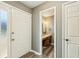 View of bathroom from hallway, featuring hard wood floors at 1057 Falling Water Se Dr, Smyrna, GA 30080