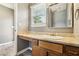 Bathroom vanity with wood cabinets and granite countertop at 1057 Falling Water Se Dr, Smyrna, GA 30080