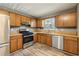 Bright kitchen features stainless steel appliances, light wood cabinets, and hardwood floors at 1057 Falling Water Se Dr, Smyrna, GA 30080