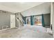 Spacious living room with fireplace, stairs, and doors leading to deck at 1057 Falling Water Se Dr, Smyrna, GA 30080