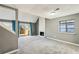 Open living room with fireplace, stairs, and doors leading to deck at 1057 Falling Water Se Dr, Smyrna, GA 30080