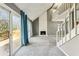 Open living room with tall ceilings, fireplace, stairs, and doors leading to deck at 1057 Falling Water Se Dr, Smyrna, GA 30080