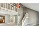 Open living room with tall ceilings, stairs, view to the kitchen and laundry room at 1057 Falling Water Se Dr, Smyrna, GA 30080