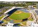 Aerial view of a baseball field surrounded by apartments, highlighting the recreational opportunities within the community at 6969 Melody Dr, Buford, GA 30518