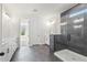 Primary bathroom features double vanity and glass enclosed shower with designer tile at 6969 Melody Dr, Buford, GA 30518