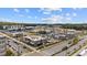 Aerial view of a retail shopping center with various storefronts and ample parking space at 6969 Melody Dr, Buford, GA 30518