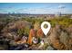 Picturesque aerial view of the property, nestled among vibrant trees with the city skyline in the distance at 1472 Lachona Ct, Atlanta, GA 30329