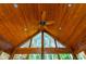 Vaulted wood ceiling with fan and recessed lighting enhances the home's rustic charm at 1472 Lachona Ct, Atlanta, GA 30329