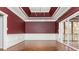 Elegant dining room with a trey ceiling and large sliding glass doors at 1472 Lachona Ct, Atlanta, GA 30329