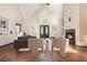 Bright living room boasts a soaring ceiling, fireplace, and elegant front doors at 1472 Lachona Ct, Atlanta, GA 30329