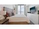 Inviting bedroom with a large window, TV, and stylish decor at 788 W Marietta Nw St # 403, Atlanta, GA 30318