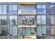 Modern condominium with large windows and outdoor balconies with seating areas at 788 W Marietta Nw St # 403, Atlanta, GA 30318