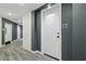 Hallway with modern gray and white walls and gray floors with unit 403 at 788 W Marietta Nw St # 403, Atlanta, GA 30318