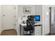 Efficient home office space with a white desk, ergonomic chair, and storage within the kitchen area at 788 W Marietta Nw St # 403, Atlanta, GA 30318