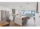Modern kitchen with an island, stainless steel appliances, and adjacent living area with city views at 788 W Marietta Nw St # 403, Atlanta, GA 30318