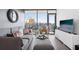 Stylish living room with city views from large windows, gray walls and floors at 788 W Marietta Nw St # 403, Atlanta, GA 30318