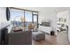 Bright living room with hardwood floors, large windows, and cozy seating area at 788 W Marietta Nw St # 403, Atlanta, GA 30318