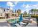Spacious backyard with a pool, spa, and covered patio, creating a luxurious outdoor living space at 710 Cox Rd, Roswell, GA 30075