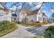Landscaped backyard with stone pathway, lush greenery, and spacious patio areas for outdoor enjoyment at 710 Cox Rd, Roswell, GA 30075