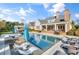 Expansive backyard featuring a pool, spa, and lush landscaping, ideal for outdoor entertaining and relaxation at 710 Cox Rd, Roswell, GA 30075