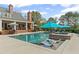 An inviting backyard paradise featuring a beautiful pool, pergola, and comfortable seating for relaxation and entertainment at 710 Cox Rd, Roswell, GA 30075