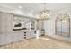Elegant bar area with mirrored backsplash and stylish pendant lighting at 710 Cox Rd, Roswell, GA 30075
