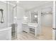 Bathroom with a glass shower, vanity, and bright neutral finishes at 710 Cox Rd, Roswell, GA 30075