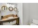 Charming half bathroom features a unique vanity with a vessel sink and decorative mirrors at 710 Cox Rd, Roswell, GA 30075
