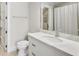 Bathroom featuring vanity with marble countertop, drawers, and sink at 710 Cox Rd, Roswell, GA 30075