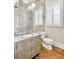 Chic powder room features decorative vanity, mirror tiles, and plantation shutters at 710 Cox Rd, Roswell, GA 30075