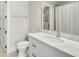 Bright bathroom featuring a shower and a vanity with white countertop at 710 Cox Rd, Roswell, GA 30075