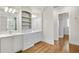 Bathroom with dual sinks, marble counters, and custom cabinets at 710 Cox Rd, Roswell, GA 30075