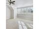 Bedroom with carpet, windows with shutter, and a ceiling fan at 710 Cox Rd, Roswell, GA 30075