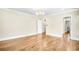 Bright bedroom with hardwood floors boasts large windows and access to walk-in closet at 710 Cox Rd, Roswell, GA 30075